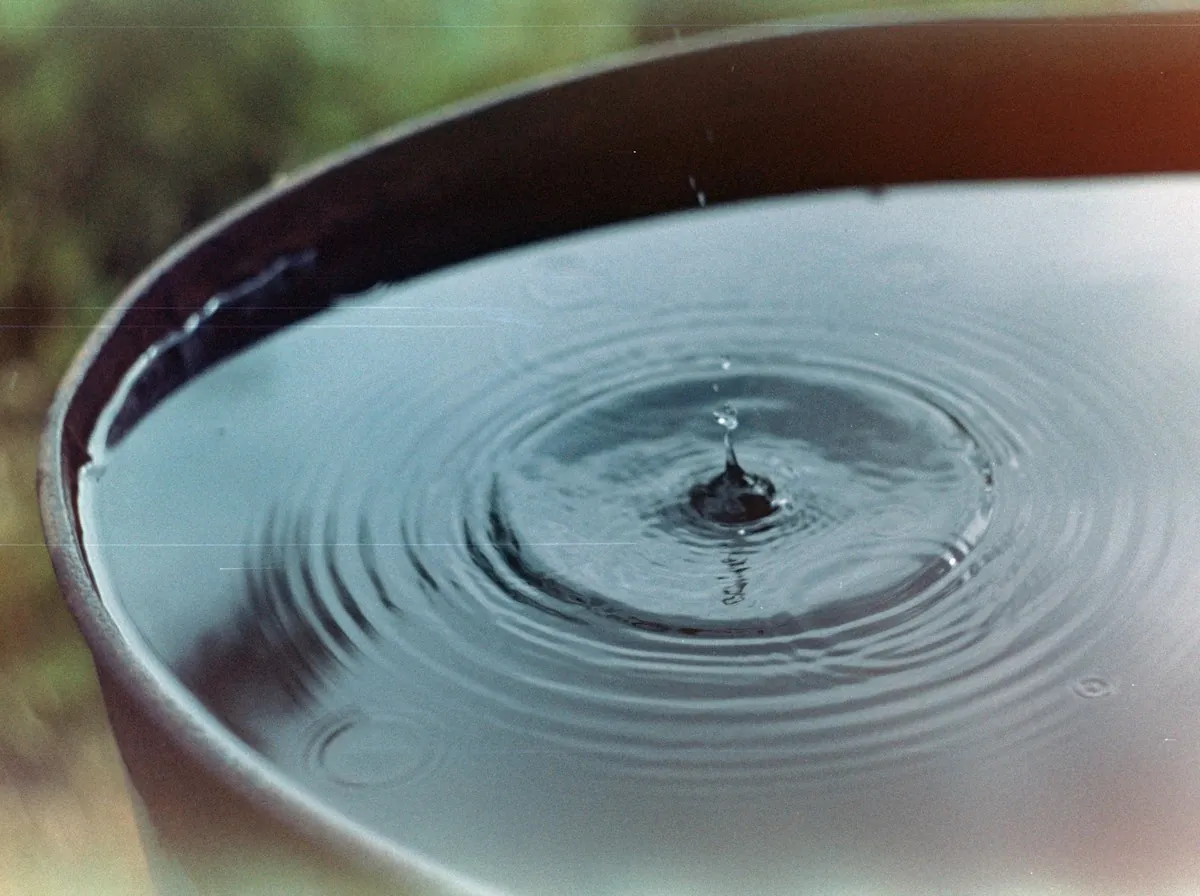 Emergency Roof Repair in Lawndale — a drip rippling the water in a basin